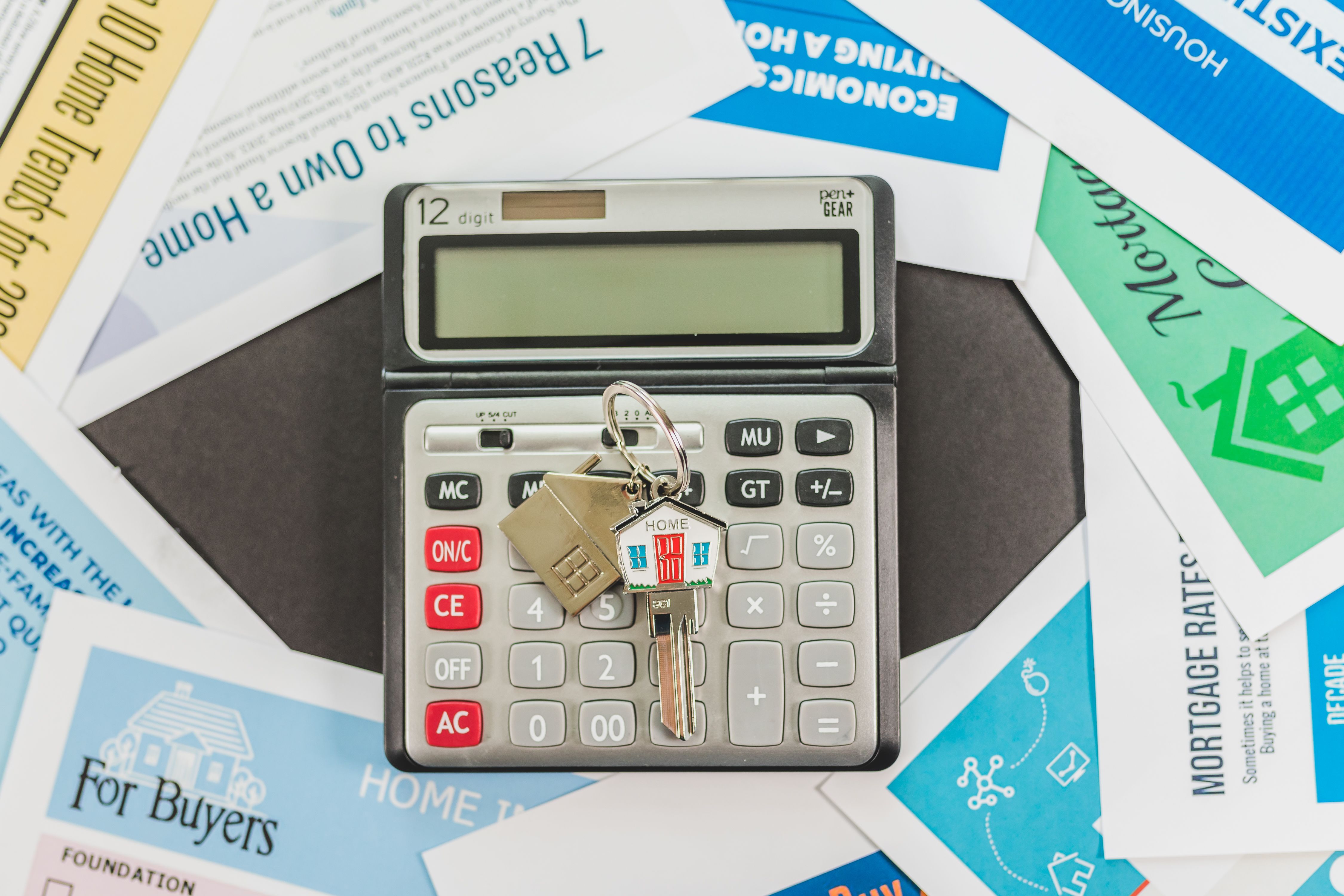 Close-up of mortgage documents and home keys.