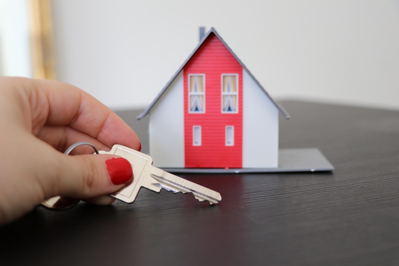 First-time homebuyer holding keys to new house