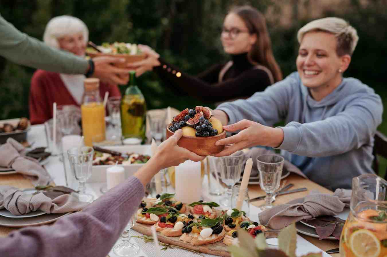 Communal outdoor Mediterranean lifestyle meal fostering social connection and stress reduction